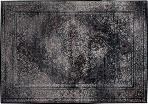 Rugged Teppich Dark von DutchBone in Gesamtansicht mit orientalischem Muster und ausgefranstem Rand in Dunkelgrau.
