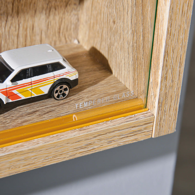 Sammlervitrine Setzkasten COLLECTIONI Sonoma-Eiche mit offenem Fach und Spielzeugauto, Detailaufnahme.