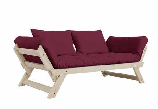 Schlafsofa BEBOP in Gesamtansicht mit bordeauxrotem Polster und natur lackiertem Holzgestell.
