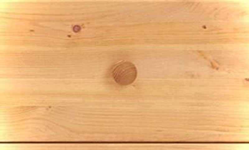 Oberflächendetail der Schubladenkommode VITA 2+3 mit Holzmaserung und Astlöchern der Kiefer massiv.