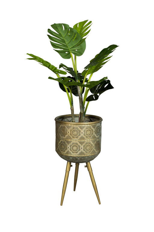 Blumenständer BOTANIQUE M von Dutchbone mit geometrischem Muster und drei Beinen, bestückt mit Grünpflanze.