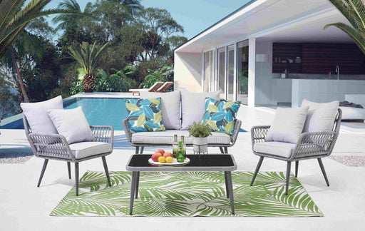 Garten Sitzgruppe 4-teilig Polyrattan grau mit Tisch und Kissen in Gesamtansicht auf einer Terrasse mit Pool im Hintergrund.