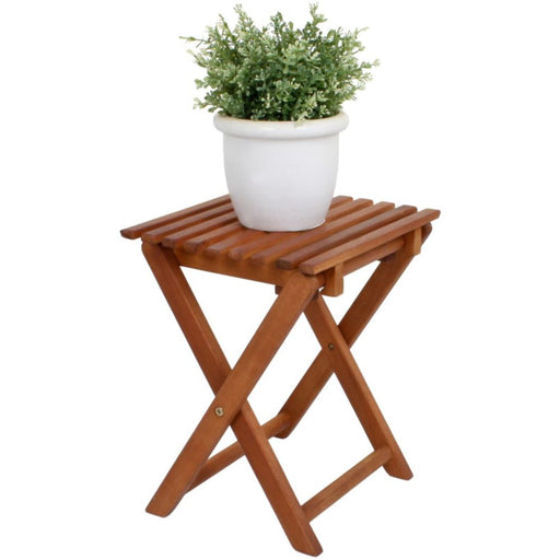 Klapphocker Gartenhocker Beistelltisch TACOMA aus Eukalyptus in Braun mit weißem Blumentopf, Gesamtansicht.
