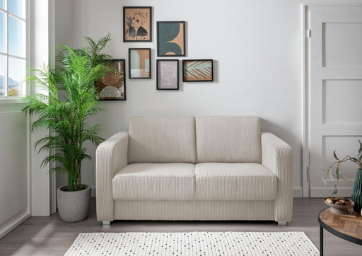 Schlafsofa Funktionssofa MIA in Hellgrau mit Cordstoff und gepolsterten Armlehnen, Frontalansicht im Wohnzimmer.