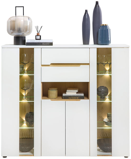 Highboard MEMPHIS Weiß mit Artisan Eiche Nachbildung und LED in Gesamtansicht mit beleuchteten Seitenvitrine.