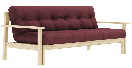 Schlafsofa UNWIND mit Kiefer-Holzrahmen und bordeauxrotem Polster in Gesamtansicht.