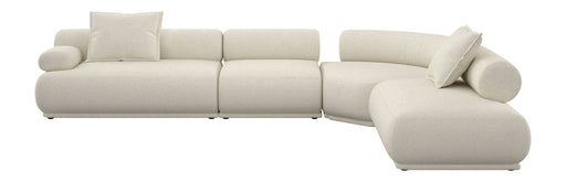 Ecksofa Rembrandt 7,5-Sitzer Links in Beige mit abgerundeten Sitzmodulen und Kissen in Gesamtansicht.