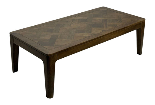 Couchtisch Mango Massivholz mit Walnuss-Finish in Gesamtansicht von schräg oben, dunkle Holzbeine und Parkett-Musterung der Tischplatte.