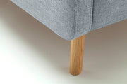 Polsterbett Lotte mit Bettkasten, gestepptem Kopfteil und Holzfüßen in Pastellblau – Ansicht 22